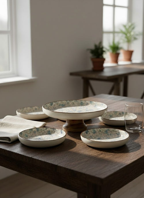 Set of ceramic bowls on a wooden table with a neutral background