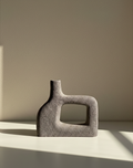 Abstract stone sculpture on a neutral background