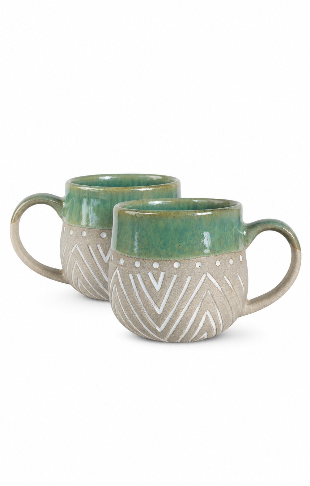 Two ceramic mugs with a green glazed upper section and a textured beige lower section featuring white geometric patterns, shown on a white background.