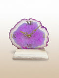 Table clock with a purple agate-like design on a beige background