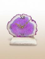 Table clock with a purple agate-like design on a beige background