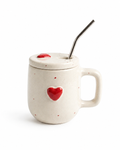 A speckled cream-colored ceramic mug with a matching lid, a small red heart on the front, and a metal straw, shown on a white background.