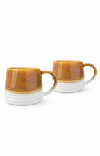 Two ceramic mugs with a brown and white horizontal two-tone design, shown on a plain white background.