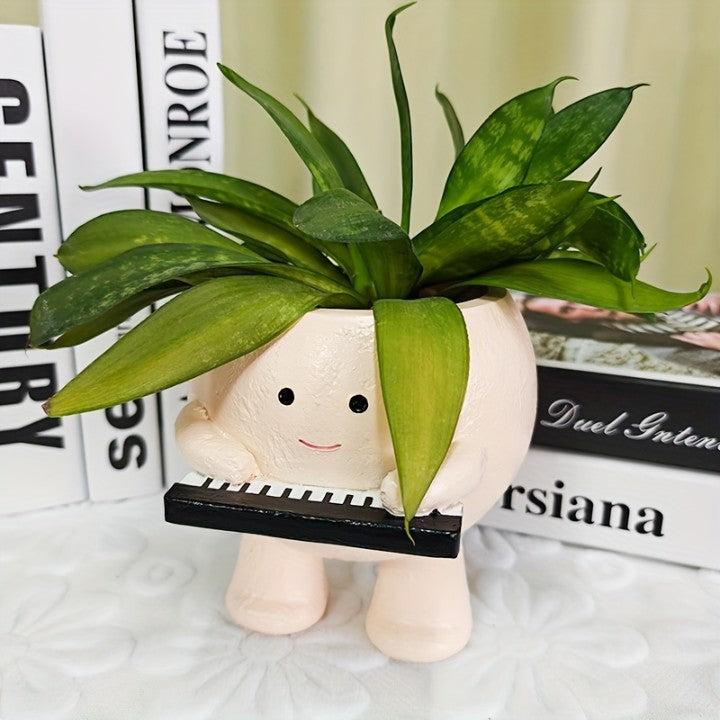 Plush toy with a face holding a potted plant on a surface with books in the background