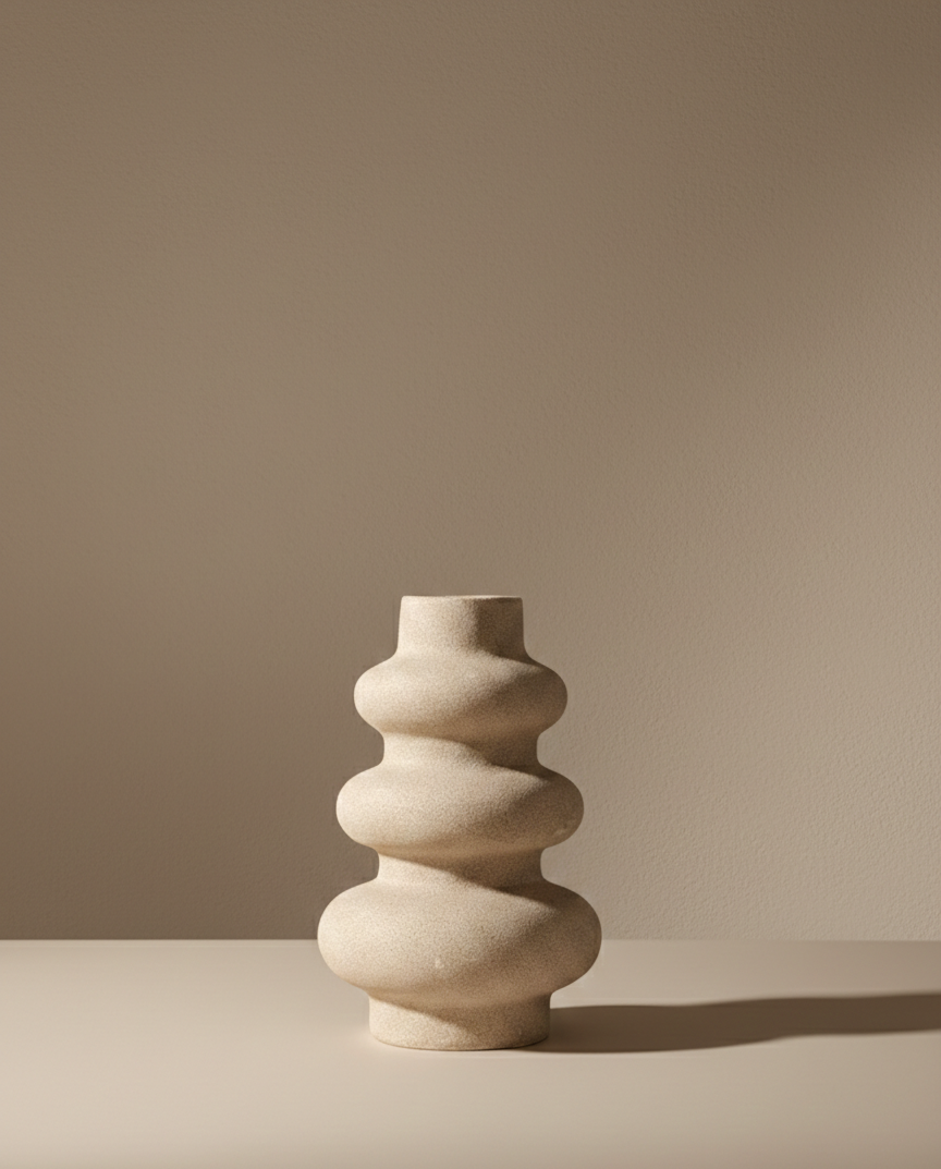 Beige ceramic vase on a beige background