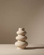 Beige ceramic vase on a beige background